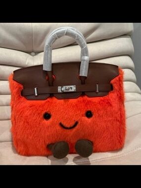 Playful Orange Fuzzy Handbag with Brown Trim and Smiling Face
